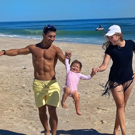 Jodi Goldberg, Mark Forks, and their daughter Sophia enjoying on Beach.